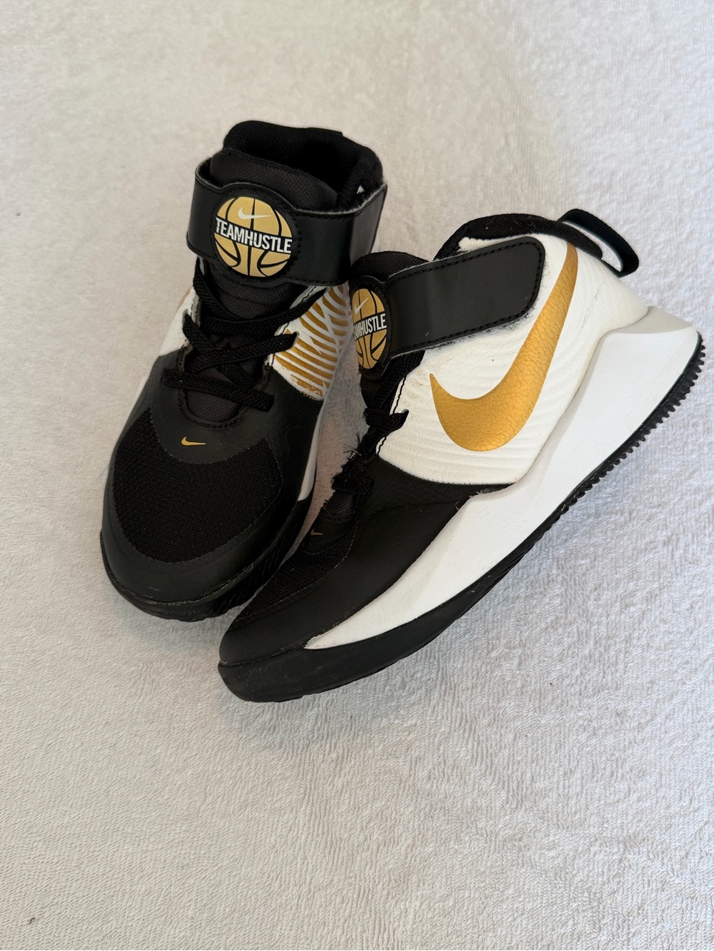 Nike Kids Black, White & Gold Team Hustle Sneakers